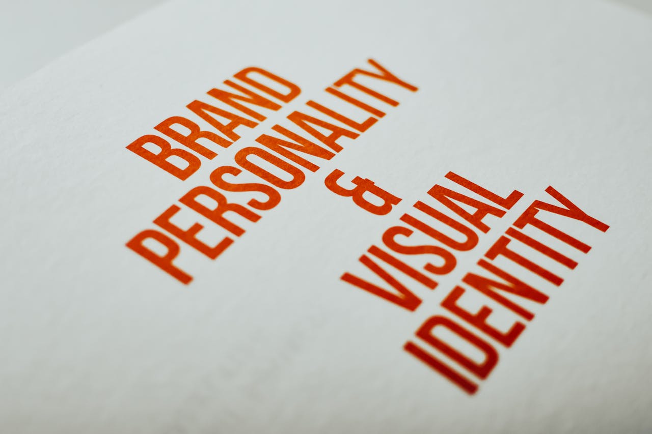 Close-up of Brand Personality & Visual Identity text in red on white paper.